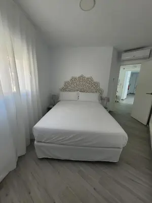 Cama o camas de una habitación en Apartamentos “Mar de Coral” Aguadulce