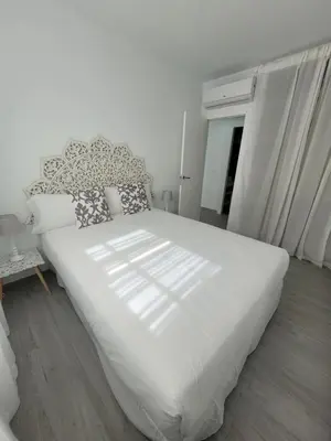 Cama o camas de una habitación en Apartamentos “Mar de Coral” Aguadulce