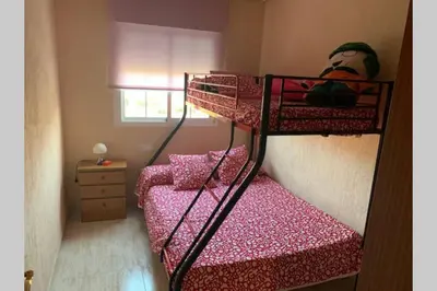 Cama o camas de una habitación en Apartamento 3 dormitorios en la playa de Almeria.