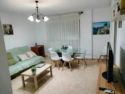 Una televisión o centro de entretenimiento en Alojamiento las Dunas