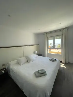 Cama o camas de una habitación en Apartamento 5 HOME SUITES ALMERÍA