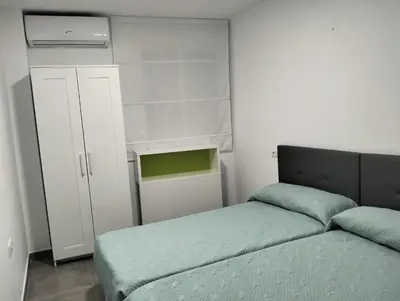 Cama o camas de una habitación en Alojamiento las Dunas alto
