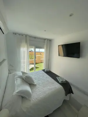 Cama o camas de una habitación en Apartamento 3 HOME SUITES ALMERÍA