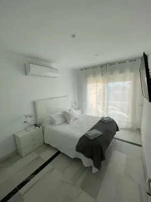 Cama o camas de una habitación en Apartamento 3 HOME SUITES ALMERÍA