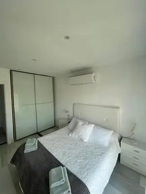 Cama o camas de una habitación en Apartamento 3 HOME SUITES ALMERÍA
