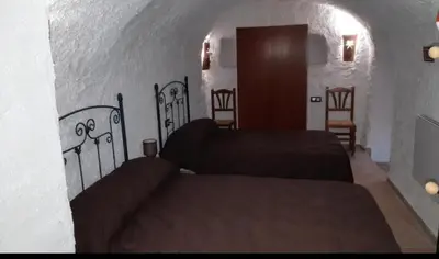 Cama o camas de una habitación en CASA CUEVA LOS HONORIOS