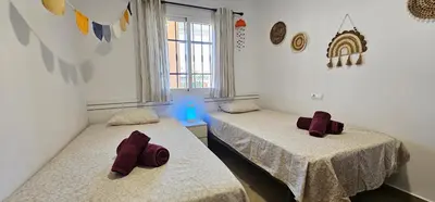 Cama o camas de una habitación en Homes of Spain, Apartamentos Paraíso Vera Playa, Fatu Hiva, Bajo A con piscina privada en jardín privado, PRIMERA LINEA de PLAYA, WIFI