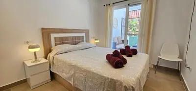 Cama o camas de una habitación en Homes of Spain, Apartamentos Paraíso Vera Playa, Fatu Hiva, Bajo A con piscina privada en jardín privado, PRIMERA LINEA de PLAYA, WIFI