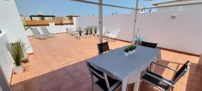 Un balcón o terraza de Homes of Spain, Apartamentos Paraíso Vera Playa, Ático Alborada con solárium grande privado, a pie de playa, WIFI