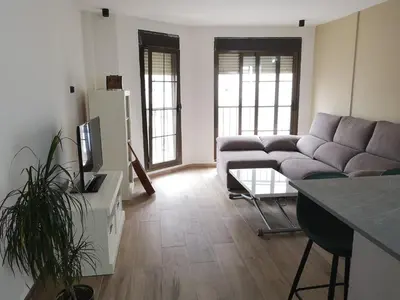 Una televisión o centro de entretenimiento en Apartamento a 1 MINUTO de la playa en GARRUCHA