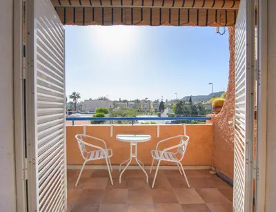 Un balcón o terraza de Natura Mediterranea estudio naturista primera linea con piscina