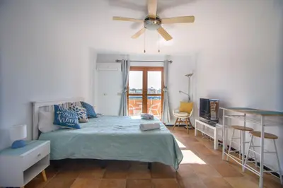 Cama o camas de una habitación en Natura Mediterranea estudio naturista primera linea con piscina