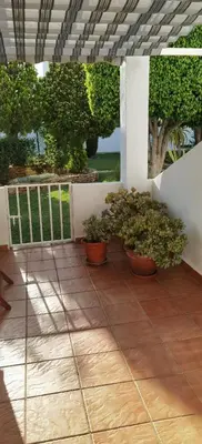 Un balcón o terraza de Duplex en urbanización con piscina comunitaria y wifi