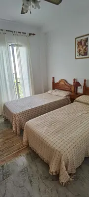 Cama o camas de una habitación en Duplex en urbanización con piscina comunitaria y wifi