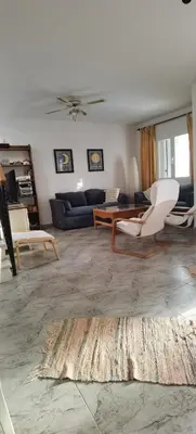 Zona de estar de Duplex en urbanización con piscina comunitaria y wifi