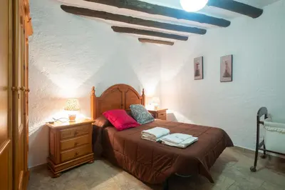 Cama o camas de una habitación en Charming House in Cádiar with View