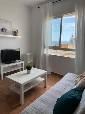 Una televisión o centro de entretenimiento en Apartamento y Piso frente al mar con vistas en Garrucha