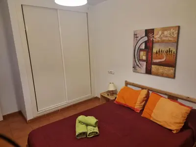Cama o camas de una habitación en Casa Baja naturista con patio en primera linea!