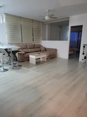 Zona de estar de Piso de lujo en la playa de un pueblo de Granada con piscina infiniti, yacuzzi en la piscina, tumbonas privadas y mucho más