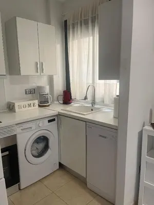 Una cocina o zona de cocina en Apartamento nuevo con piscina en la envía golf aguadulce Almería