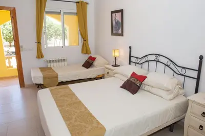 Cama o camas de una habitación en Casa Ana - delightful semi-detached villa with large swimming pool, tennis court and huge gardens plus Free wifi
