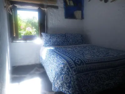 Cama o camas de una habitación en La Casa de la Bombilla Verde