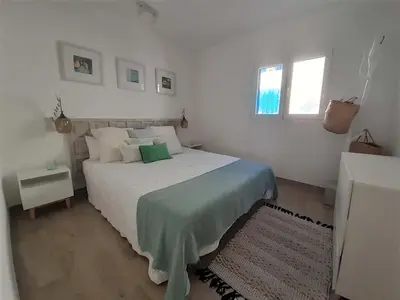 Cama o camas de una habitación en Precioso Apartamento a 20 metros del mar