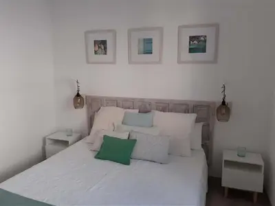 Cama o camas de una habitación en Precioso Apartamento a 20 metros del mar