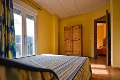 Cama o camas de una habitación en Alojamiento Rural Sierra de Jerez