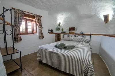 Cama o camas de una habitación en Alojamiento Cuevas Victoria