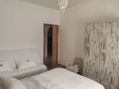 Cama o camas de una habitación en Encantadora casa rural con gran porche
