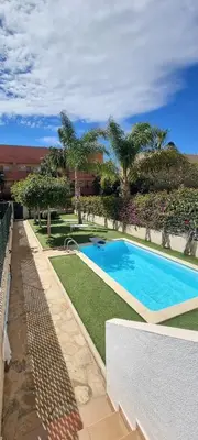 Piscina en o cerca de Homes of Spain, Apartamentos Paraíso Vera Playa, Ed Nuku Hiva, Bajo W con jardín y piscina privada a pie de playa, WIFI