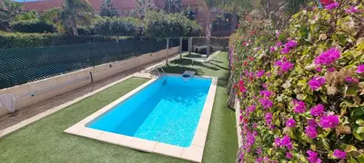 Piscina en o cerca de Homes of Spain, Apartamentos Paraíso Vera Playa, Ed Nuku Hiva, Bajo W con jardín y piscina privada a pie de playa, WIFI