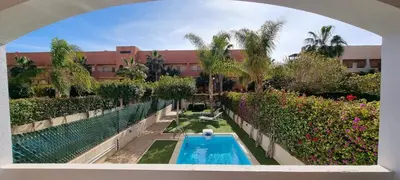 Piscina en o cerca de Homes of Spain, Apartamentos Paraíso Vera Playa, Ed Nuku Hiva, Bajo W con jardín y piscina privada a pie de playa, WIFI