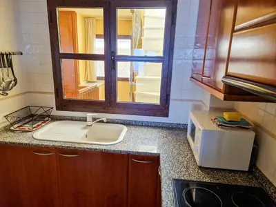 Una cocina o zona de cocina en PUERTO13 AMANECER MEDITERRÁNEO