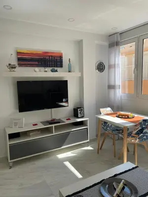 Una televisión o centro de entretenimiento en Apartamento Costa de Almería a 50m Playa San Miguel