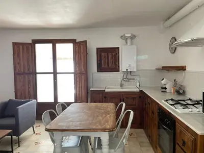 Una cocina o zona de cocina en Apartamentos El Cabo