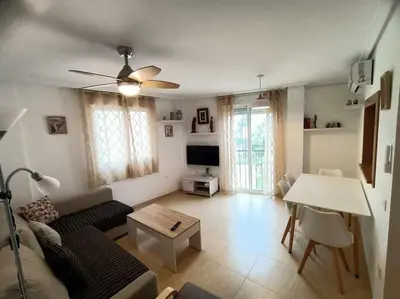 Una televisión o centro de entretenimiento en La Glorieta-Apartamento céntrico con vista al mar