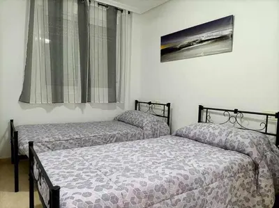 Cama o camas de una habitación en La Glorieta-Apartamento céntrico con vista al mar