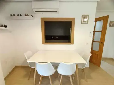 Una televisión o centro de entretenimiento en La Glorieta-Apartamento céntrico con vista al mar