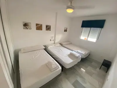 Cama o camas de una habitación en Apartamento Familiar Torre del Rayo