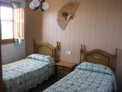 Cama o camas de una habitación en Alojamiento Rural Mirador del Avellano