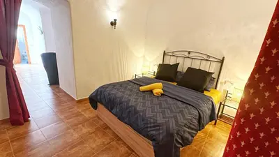 Cama o camas de una habitación en Troglorent - Maison Troglodyte