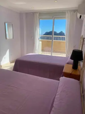Cama o camas de una habitación en Apartamento magnificas vistas al mar