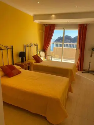 Cama o camas de una habitación en Apartamento magnificas vistas al mar