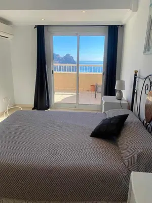 Cama o camas de una habitación en Apartamento magnificas vistas al mar