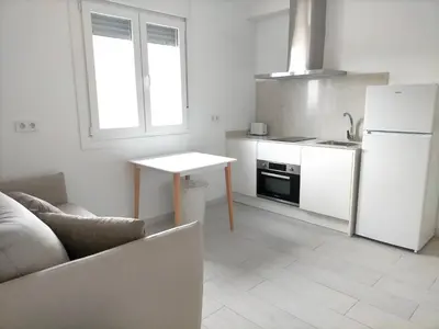 Una cocina o zona de cocina en Precioso loft con piscina comunitaria