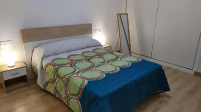 Cama o camas de una habitación en Atractivo apartamento en la playa con parking