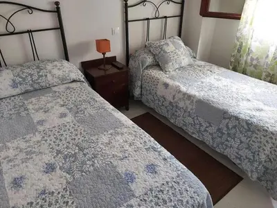 Cama o camas de una habitación en Apartamento Vera Playa (ALTOS NUEVA VERA)