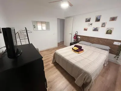 Cama o camas de una habitación en Piso agradable cerca de la playa